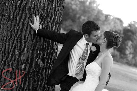 couple kisses by a tree on the golf course in this moment kissing couples couples