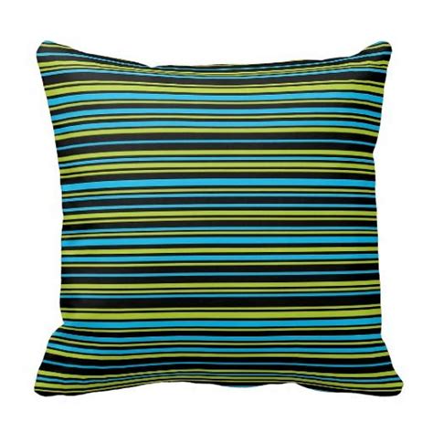 A Blue And Green Striped Pillow On A White Background