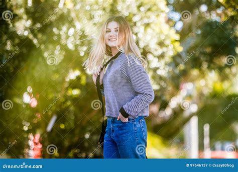 Outdoor Portrait Of Young Happy Smiling Teen Girl On Natural Background