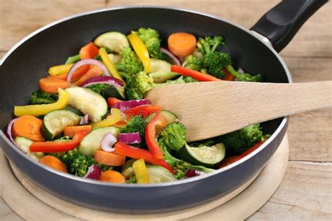Frying Food Vegetables In Cooking Pan With Spatula Stock Image Image