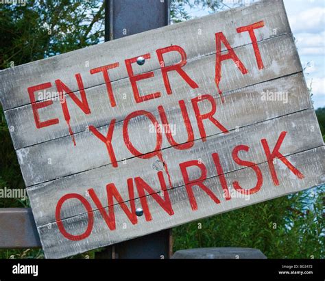 Enter At Your Own Risk Sign Stock Photo Alamy