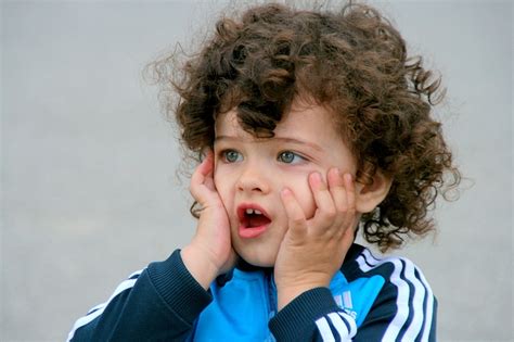 Daughter sitting on shoulders of mother. Curly hair child public domain free photos for download ...