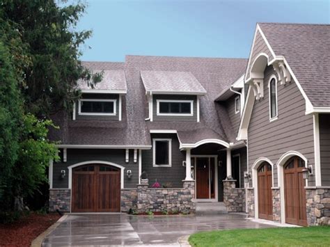 Because choosing the wrong color can cost your more money or even leave you more and more we are getting customers requesting to paint their home black and for good reason: Exterior Color Schemes with Gray Accents - Traba Homes