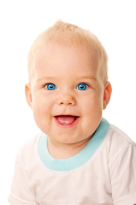Primer De Ojos Azules Sonriente De La Cara Del Bebé Imagen De Archivo