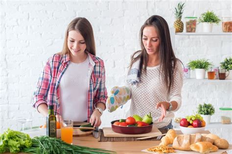 Two Girls Friends Preparing Dinner In Kitchen Cooking Salad Stock Image Image Of Home Diet