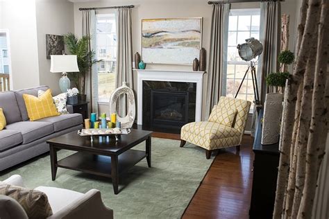 Neutral Grey Living Room With Pops Of Teal And Yellow By Designer Ash