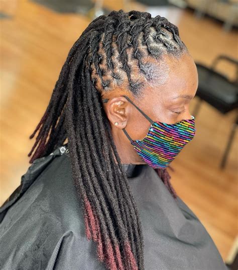 50 creative dreadlock hairstyles for women to wear in 2022 hair adviser mohawk dreads dyed
