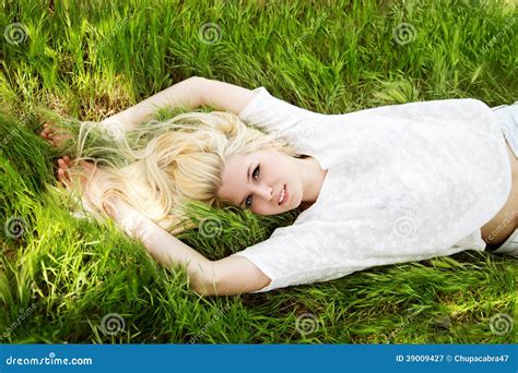 Beautiful Blonde Girl Lying In Green Field Stock Image Image Of Adult Life 39009427