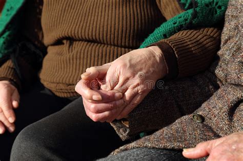Elderly Couple Holding Hands In A Sign Of Love Stock Photo - Image of couple, holding: 50290274