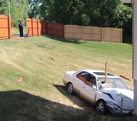 Woman Injured When Car Crashes Through Fence Hits House Local News