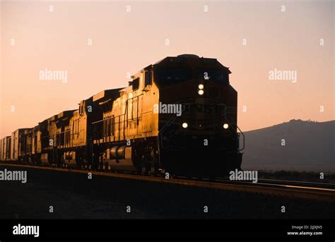 Bnsf Freight Train Heads East Through Tehachapi At Sunset Stock Photo