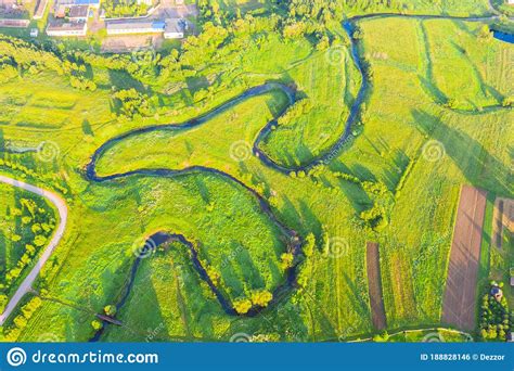 Top Aerial View Of The Natural Rural Landscape Valley Of A Meandering