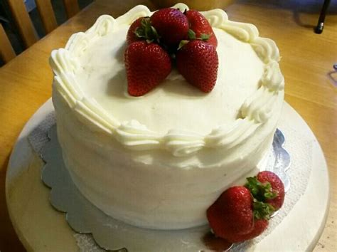 Lemon Cake With Cheesecake Cream Filling Sliced Berries White Chocolate Drizzle And Cream