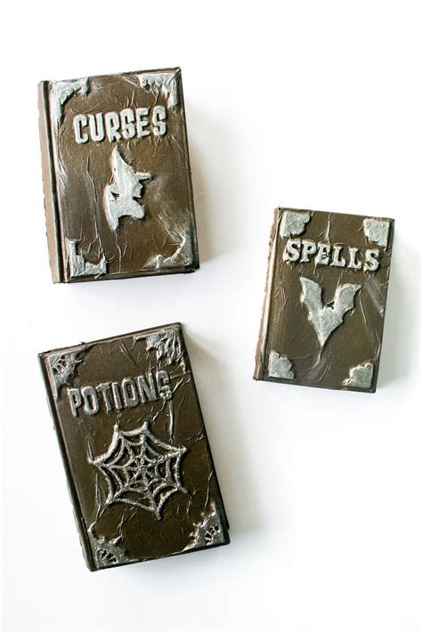 Kids can use adhesive such as elmer's adding some spell pages in the middle of your completed witch spell book is a great idea because you can then have this prop open or closed to. DIY Halloween Witches' Spell Book Grimoire // Salty Canary ...