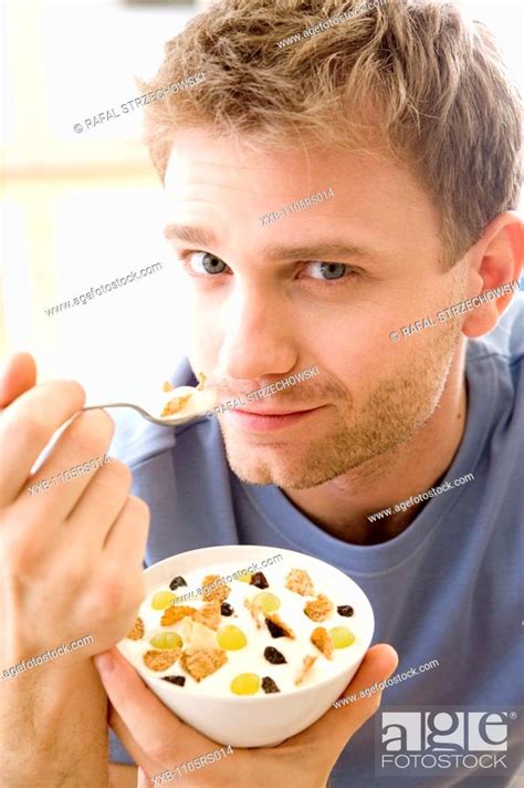 Men Eating Breakfast Cereals Stock Photo Picture And Royalty Free