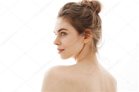 Portrait Of Young Beautiful Tender Nude Girl With Bun Standing Back To