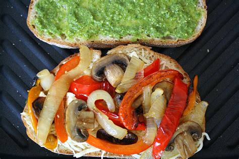 Brush the inside of the roll with pesto instead of olive oil and add 3 or 4 slices roasted turkey breast to the sandwich. The Garden Grazer: Roasted Vegetable Panini with Pesto