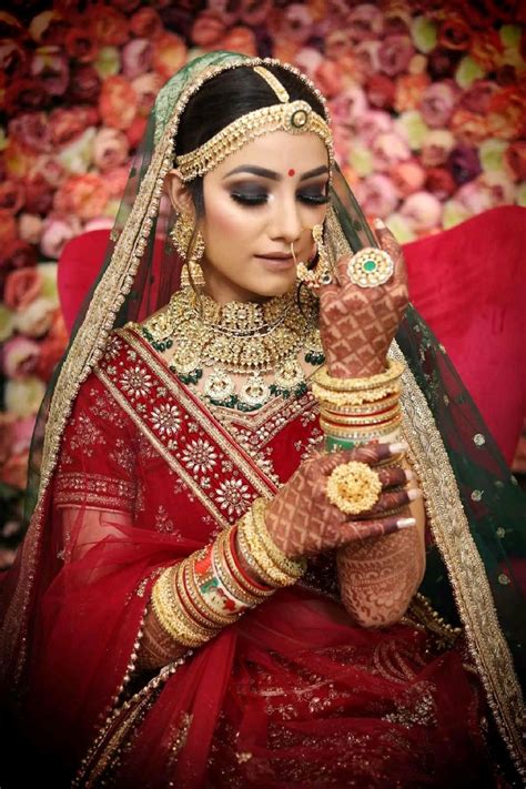 Beautiful Indian Girl In Bride Look Wearing Red Lehanga And Gold