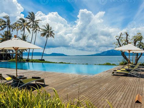Beautiful Tropical Swimming Pool In Hotel Or Resort With Umbrella