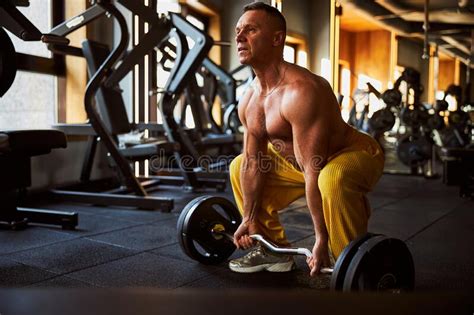 Strong Man Going Low To Lift A Heavy Barbell Stock Photo Image Of