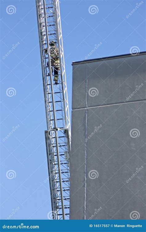 Firefighter Climbing An Aerial Ladder Stock Image Image Of Fire Fair