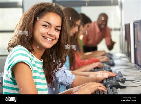 Group Of Students Working At Computers In Classroom Stock Photo Alamy