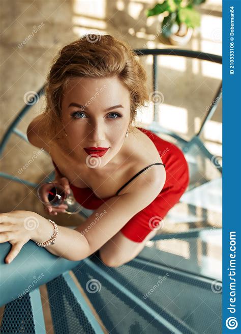 Elegant Woman In Red Dress And High Heels Staying On Stairs Evening Style Chic Elegant Woman