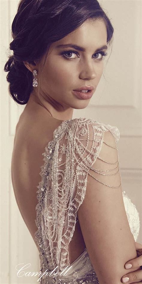 A Woman In A Wedding Dress Posing For The Camera With Her Hand On Her Hip