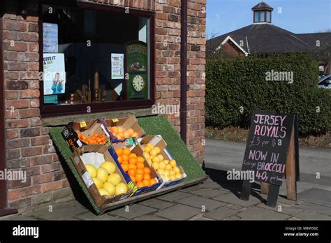 fresh fruit and vegetables on display outside a roadside greengrocers shop local food from