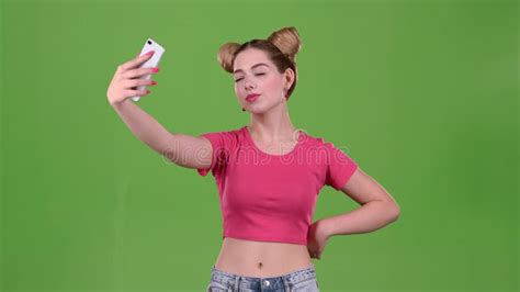 teen doing selfie on selfie stick green screen slow motion stock video video of selfie girl
