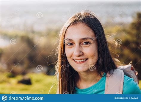 Close Up Smiling Young Girl With A Backpack On The Top Of A The Hill