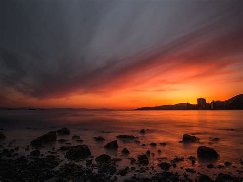 Sea Sunset Stones Horizon Sky Coast Hd Wallpaper Peakpx