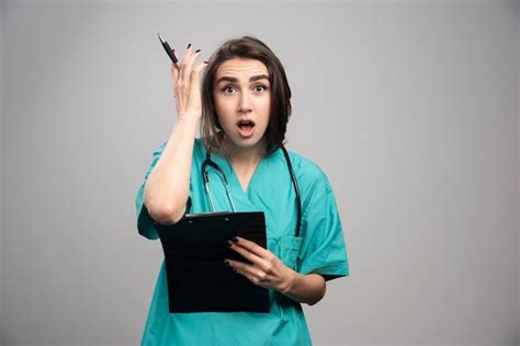 Free Photo Female Doctor Surprised On Gray Background High Quality Photo