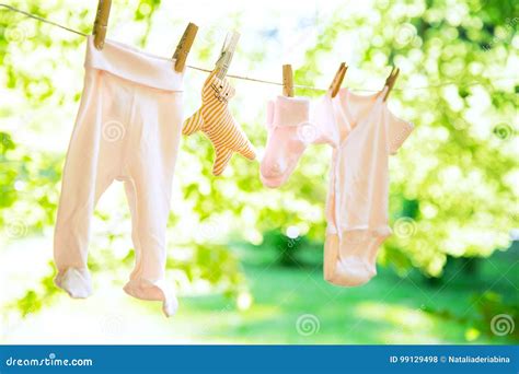 Baby Clothes Hanging On The Clothesline Stock Photo Image Of