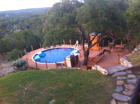 This is the track that the pool's wall fits into. Above ground pool deck in the Texas Hill Country. Two level deck with outdoor kitchen and r ...