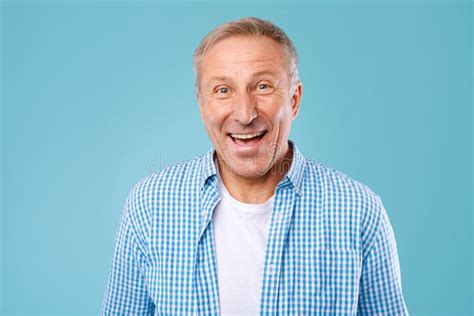 Portrait Of Happy Mature Man Laughing Posing At Studio Stock Photo