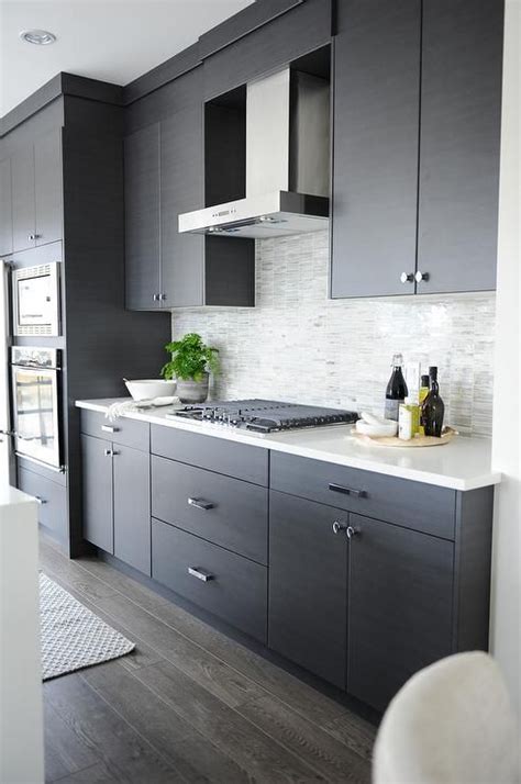 You can the contemporary kitchen borrows tall functionality and streamlined surfaces from the modernist design movement, but its style often incorporates usual. Dark Gray Flat Front Kitchen Cabinets with Gray Mosaic ...
