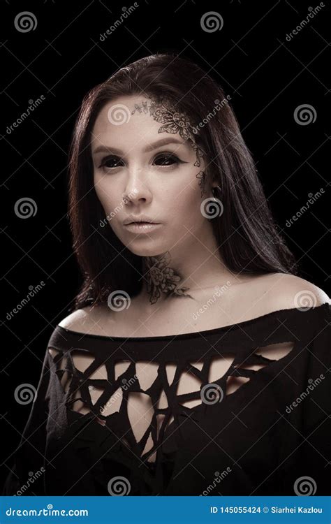 Portrait Of A Young Brunette Woman With Black Eyes And A Lacy Pattern