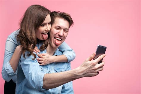 Premium Photo Cheerful Couple Taking Selfie