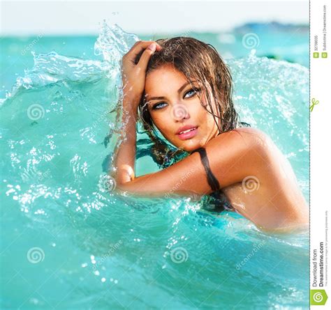 Sexy Model Girl Swimming And Posing Royalty Free Stock