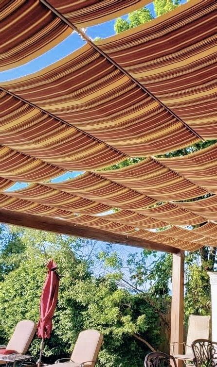 Striped Fabric Retractable Wave Shade Canopies Over Patio In 2023