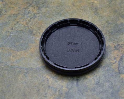 Genuine Minolta Celtic 57mm Push On Front Lens Cap For 55mm Front