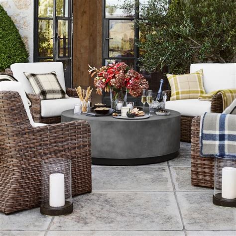Concrete takes on alluring shapes rounded, polished, and finished in a slate grey. Lucca Concrete Outdoor Round Coffee Table | Patio ...