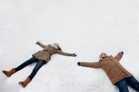 Young Couple Making Snow Angels Stock Photo Download Image Now Istock