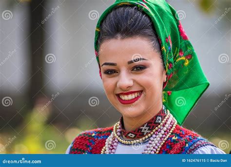 Portrait Of A Romanian Woman Wearing Traditional National Costume