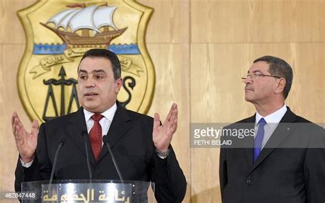 tunisia s new prime minister habib essid stands next to his news photo getty images