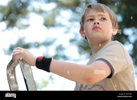 Young Boy Climbing Ladder Model Released Stock Photo Alamy