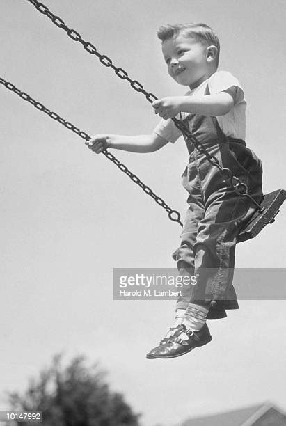 Child On Swing Black And White Photos And Premium High Res Pictures