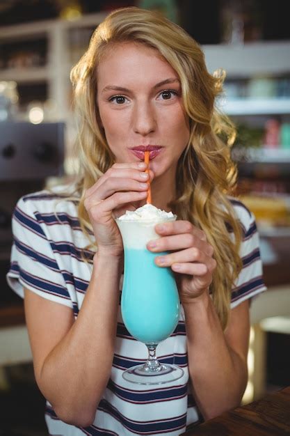 Premium Photo Woman Drinking Milkshake With A Straw