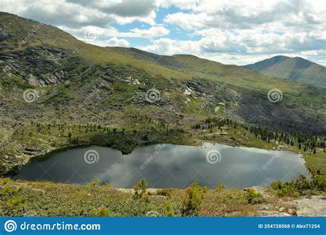 A Large Picturesque Lake Surrounded By High Gently Sloping Mountains
